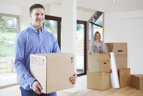 Removal crew handling desks and equipment in a commercial move