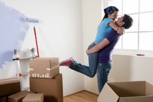 Movers loading household items for transport in Sidcup
