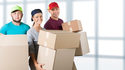 Team coordinating an office relocation with labels and packing boxes