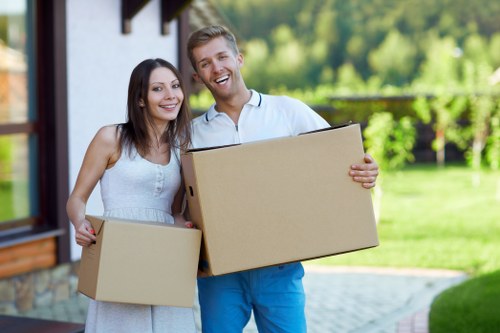Packed household items prepared for transport by man and van