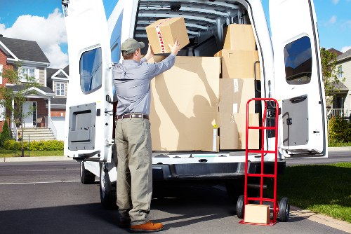 Professional movers loading items into a van for a Sidcup relocation